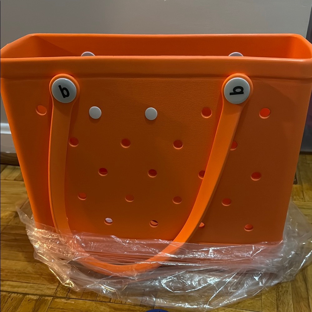 BOGG BAG Orange Tote with Smooth Glossy Finish and Perforated Design
new